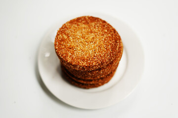 Homemade Baked Biscuits or Cookies in a White Dish on White Table