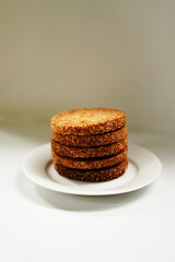 Delicious Homemade Biscuits or Cookies in White Plate with Plain White Background