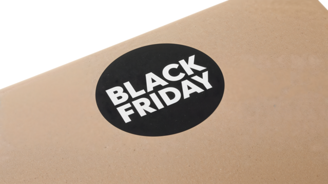 Black friday sale sticker on cardboard box: holiday shopping and discount concept