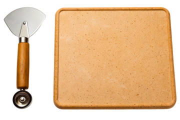 Wooden handled pizza cutter alongside rectangular pizza baking stone isolated with transparent background