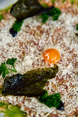 A gourmet dish featuring a blend of fresh ingredients and an artistic presentation, highlighting textures and vibrant colors that stimulate the senses.