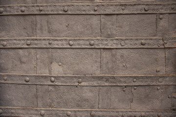 Detailed view of an old riveted metal surface with weathered texture