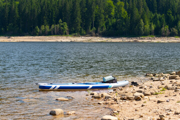 sup board on the lake, Stony Coast with forest in the background
