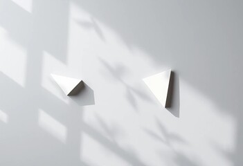 Abstract gray background, overlapping triangular paper cutouts cast realistic shadows,  graphic,  sophisticated