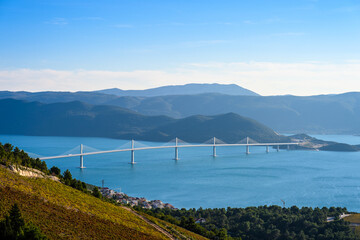 Peljesac Bridge in southern Croatia captured from multiple angles showcasing elegant design blue...