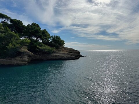 Amazing Mediterranean sea, coast overgrown pines and beautiful cloudy sky.