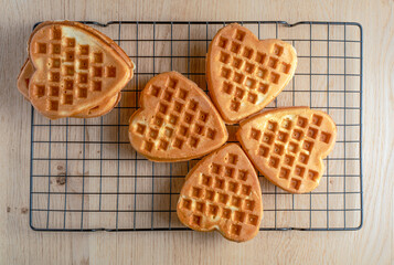Heart-shaped waffles on a cooling rack