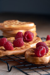 Assortment of heart-shaped waffles with raspberries