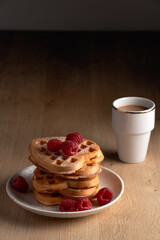 Breakfast waffles with raspberries and coffee