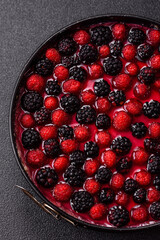 Pie, cheesecake with raspberries and blackberries, mascarpone cheese. Piece of cheesecake