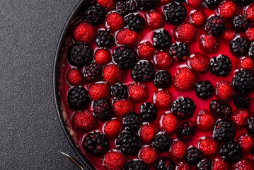 Pie, cheesecake with raspberries and blackberries, mascarpone cheese. Piece of cheesecake