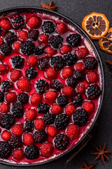 Pie, cheesecake with raspberries and blackberries, mascarpone cheese. Piece of cheesecake