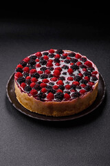 Pie, cheesecake with raspberries and blackberries, mascarpone cheese. Piece of cheesecake