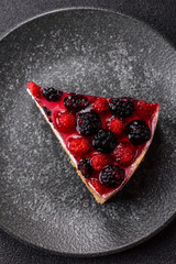 Pie, cheesecake with raspberries and blackberries, mascarpone cheese. Piece of cheesecake