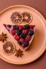 Pie, cheesecake with raspberries and blackberries, mascarpone cheese. Piece of cheesecake