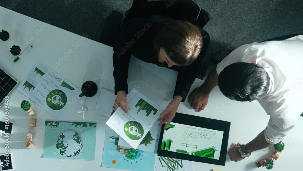 Poster top down view of business man presenting sustainable idea to manager by using tablet display esg env
