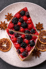 Pie, cheesecake with raspberries and blackberries, mascarpone cheese. Piece of cheesecake
