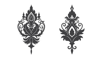 Two ornate decorative elements with intricate scroll work and floral motifs silhouette