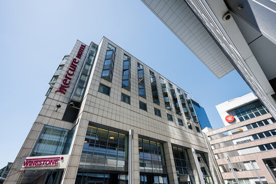Modern Mercure hotel building with unique design in Warsaw under clear blue sky