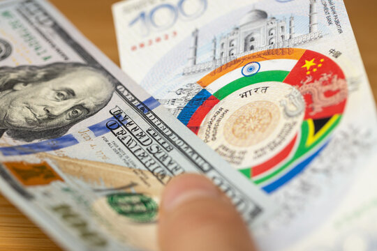 BRICS group banknote design and 100 US dollar . Financial and economic concept. Common currency of the BRICS countries. - Powered by Adobe