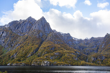 Autumn landscape in Lofoten Islands, Northern Norway, featuring colorful foliage, and a peaceful...
