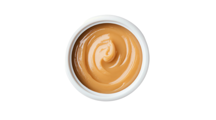 Creamy peanut butter in a white bowl, perfect for spreads or snacks on a white isolate background.