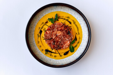 A Gourmet Dish Featuring Succulent Meat Crafted Perfection with Vibrant Sauce and Edible Garnishes for an Exquisite Culinary Experience
