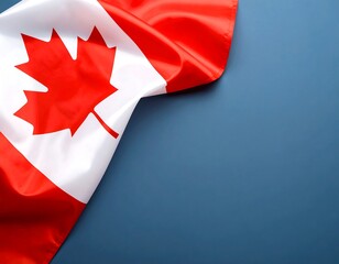 Canadian flag draped over a muted blue surface