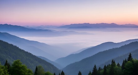 Obraz premium A misty sunrise over the mountains creates a breathtaking landscape