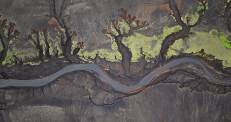 Fiji, Tana Island: Aerial drone footage revealing a sinuous river winding through the striking...