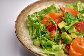 A Fresh, Colorful Salad with Greens, Avocado, Grapefruit, and Salmon Combining for a Healthy, Delicious Culinary Experience
