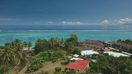 Stunning aerial view capturing Tahiti's idyllic landscape with turquoise waters, vibrant coral...