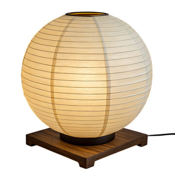 Traditional japanese paper lantern with warm light on a wooden base