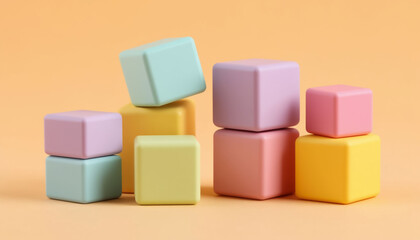 Obraz premium Children's toy rubber cubes on pastel cream background