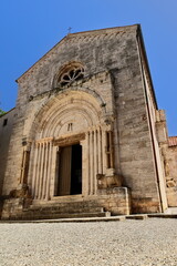 Collegiata dei Santi Quirico e Giulitta Church, Romanesque main portal showing two facing crocodiles on the architrave. San Quirico d'Orcia-Italy-121