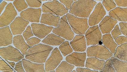 Textured Natural Stone Paving Pattern with Light Grout Lines