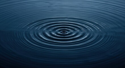 Fototapeta premium Ripples on dark blue water showing concentric circles