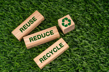 Reuse reduce recycle text and symbol on wood block sustainable concept