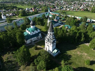 An aerial perspective of the Holy Annunciation Monastery in Kirzhach, offering a broad view of the city and its surrounding landscape
