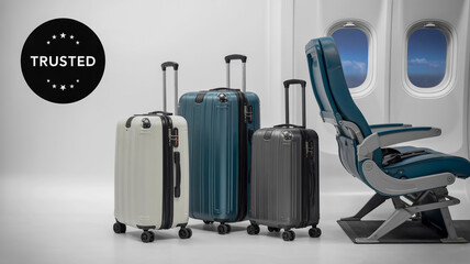 Naklejka premium A product photography composition featuring three modern hardshell suitcases in front of an airplane window