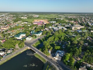 An aerial view showcasing Kirzhach city with its buildings extending along the banks of a river