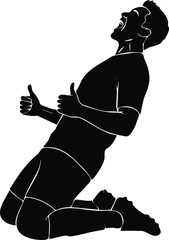 Silhouette of a soccer player celebrating a goal on his knees
