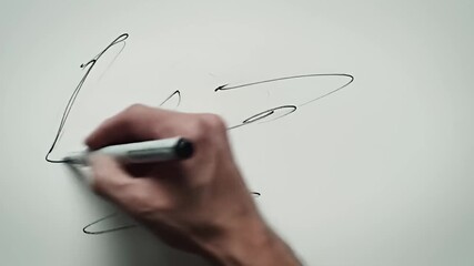 Abstract drawing of curved lines with a hand holding a marker in motion on white