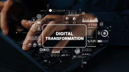 Close-up of Hands on Keyboard with Digital Transformation Concept Overlaid and Data Visualization...