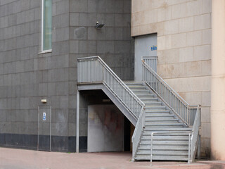 Metal stair and rail for quick exit from building