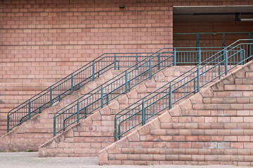 Metal stair and rail for quick exit from building