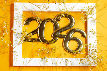 Golden 2026 Numerals in a Frame Surrounded by yellow gypsophila  Flowers