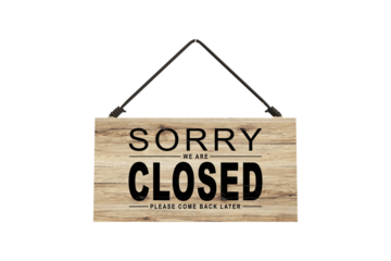 A closed sign posted on glass door of store. Concept of shop service business closed on holidays.