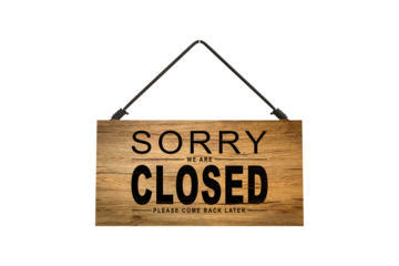 A closed sign posted on glass door of store. Concept of shop service business closed on holidays.