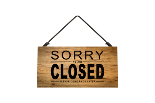 A closed sign posted on glass door of store. Concept of shop service business closed on holidays.